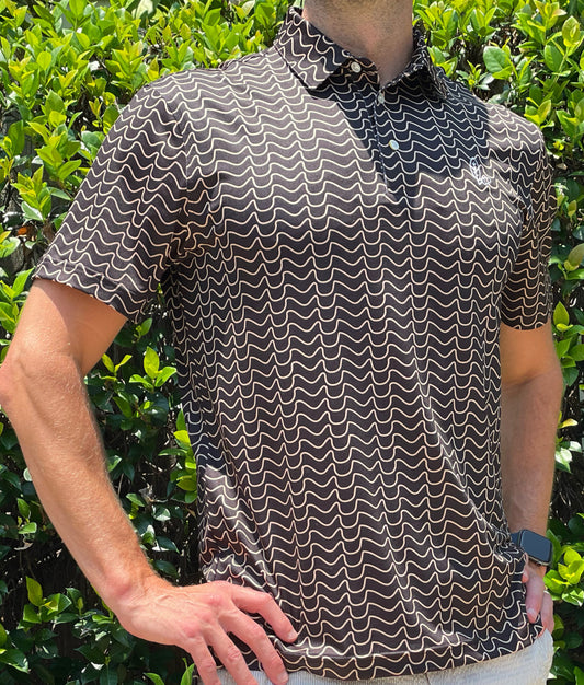 Introducing our Dat River Men's Performance Polo, a pinnacle of style and functionality. Immerse yourself in the Who Dat theme featuring unique design elements inspired by the rich culture and energy of the city, you'll stand out on game day whether you're in the Superdome or watching at your neighborhood bar. Model: Ray Clement